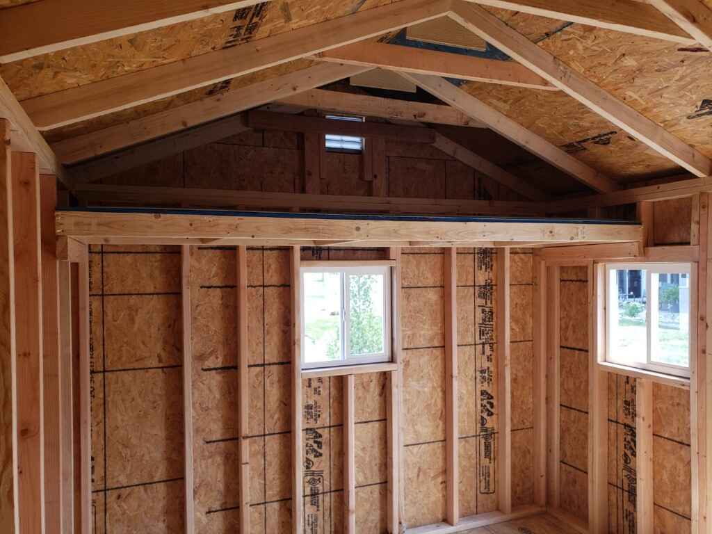 Custom shed built on site with 32" deep storage loft
